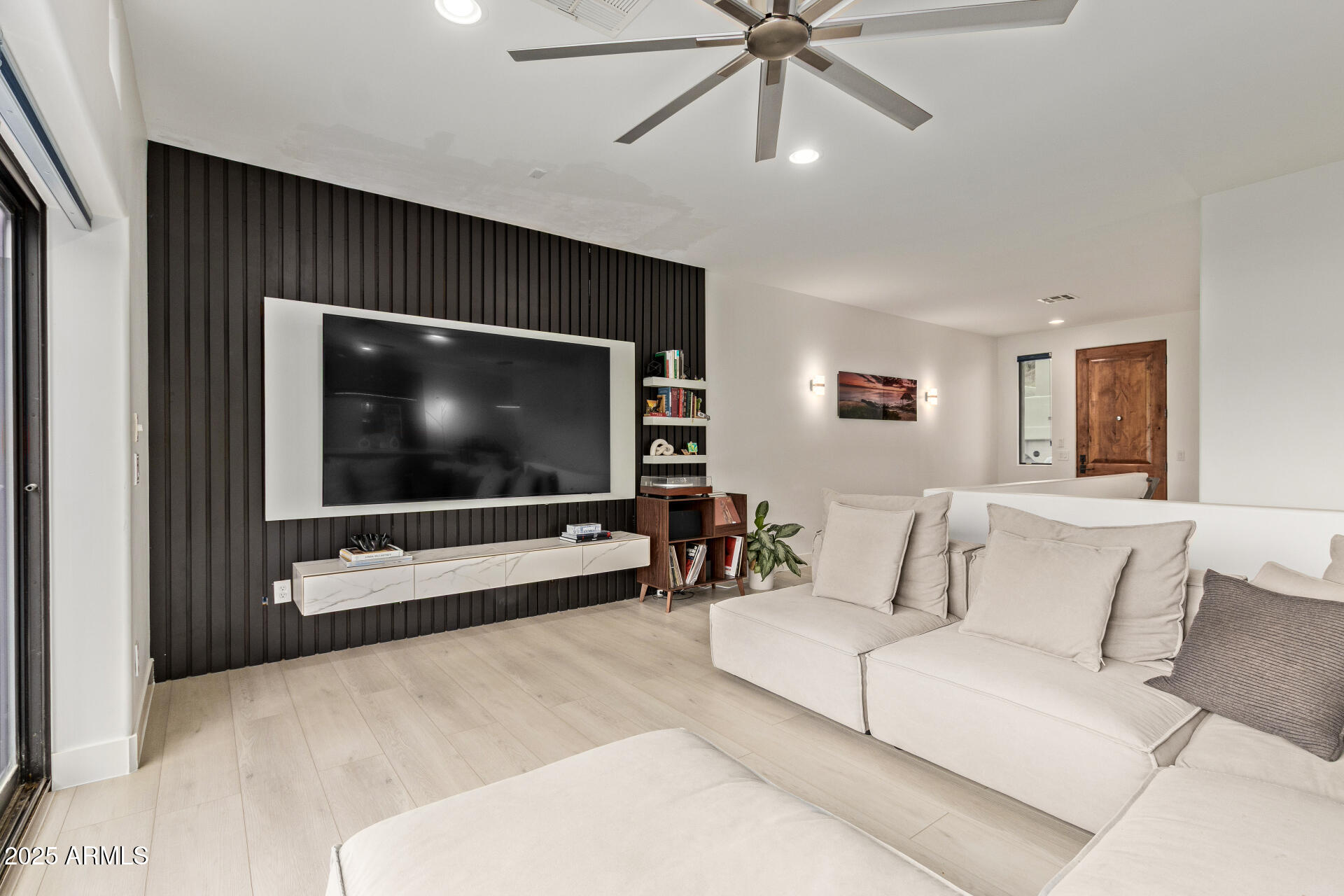 10011 North 1st Avenue Phoenix, AZ 85021 - Photo 8 of 23 a living room with furniture and a flat screen tv