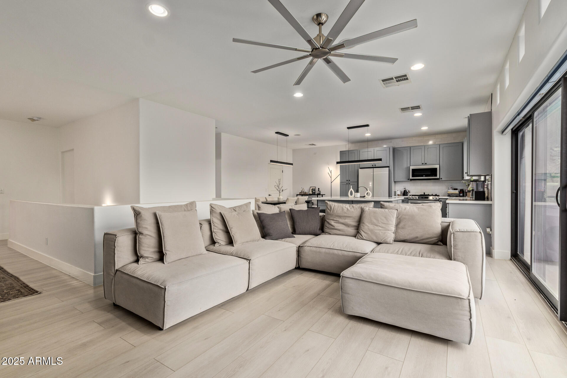 10011 North 1st Avenue Phoenix, AZ 85021 - Photo 9 of 23 a living room with furniture and a view of kitchen
