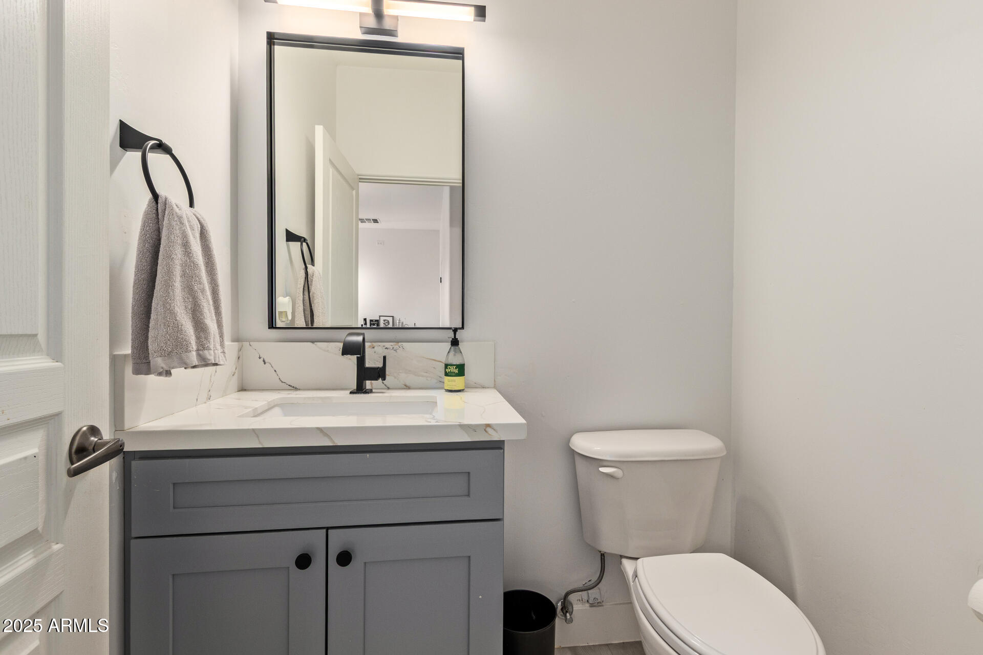 10011 North 1st Avenue Phoenix, AZ 85021 - Photo 10 of 23 a bathroom with a toilet a sink and a mirror