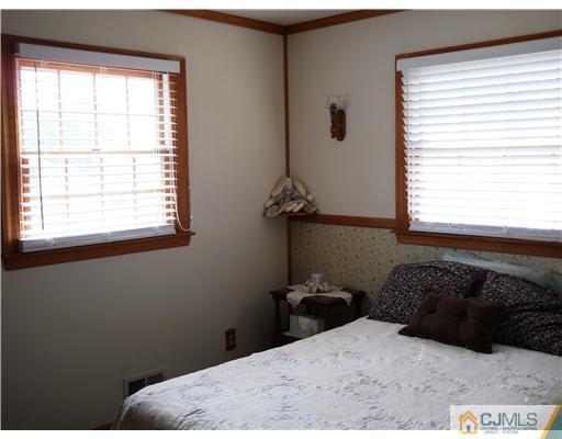 15 Hansen Road Old Bridge, NJ 08857 - Photo 14 of 22 a bedroom with a bed window and a window