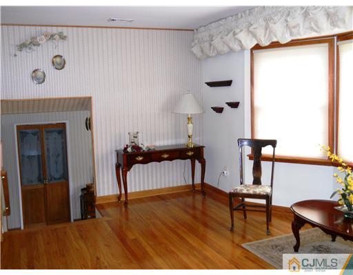 15 Hansen Road Old Bridge, NJ 08857 - Photo 3 of 22 a view of workspace with furniture and wooden floor