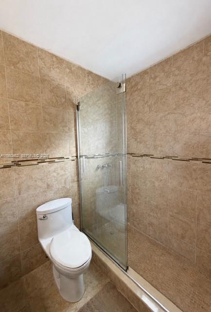 7792 West 29th Way, Unit 202 Hialeah, FL 33018 - Photo 7 of 14 a bathroom with a toilet and a shower