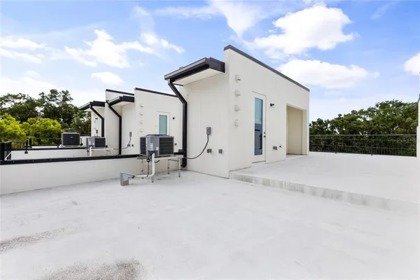 a view of a house with roof and sitting area