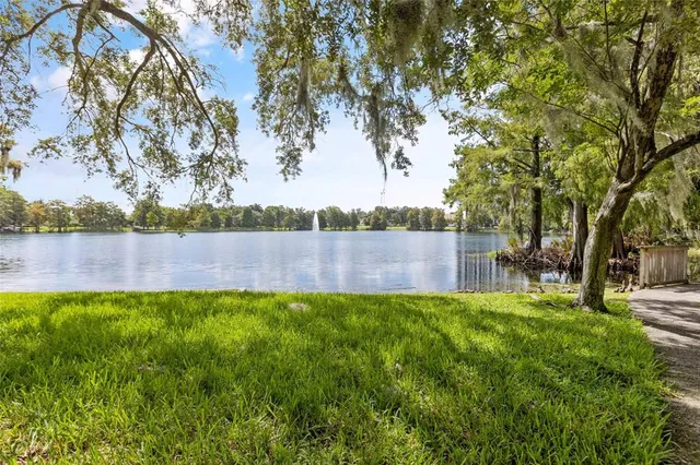 a view of a lake with houses in the back
