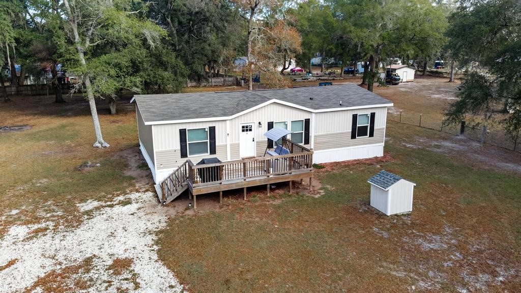 1088 Mulberry Landing Road Hilliard, FL 32046 - Photo 1 of 30 a view of a white house with a sink and a yard