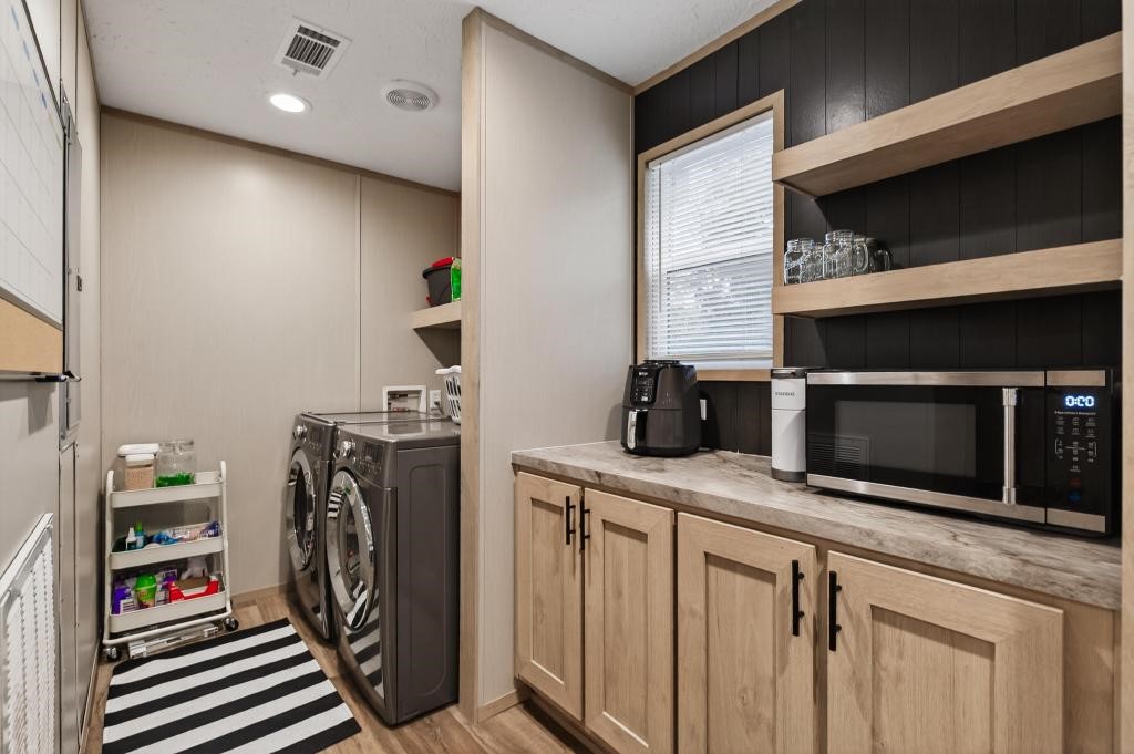 1088 Mulberry Landing Road Hilliard, FL 32046 - Photo 14 of 30 a kitchen with stainless steel appliances granite countertop a stove a microwave and a refrigerator