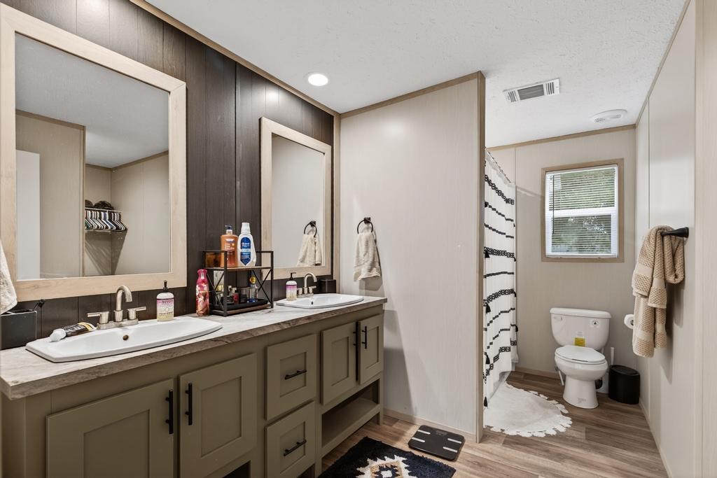 1088 Mulberry Landing Road Hilliard, FL 32046 - Photo 19 of 30 a bathroom with double sink and mirror