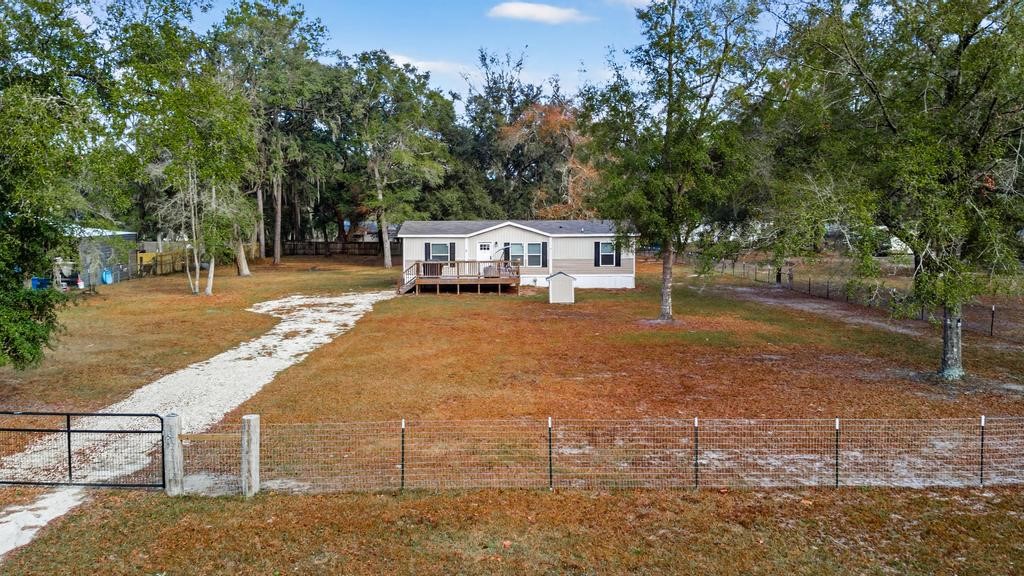 1088 Mulberry Landing Road Hilliard, FL 32046 - Photo 2 of 30 a view of a yard with plants and trees