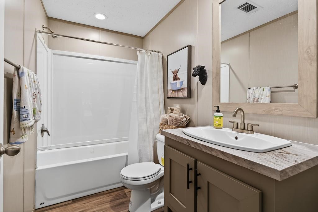 1088 Mulberry Landing Road Hilliard, FL 32046 - Photo 21 of 30 a bathroom with a sink toilet and shower
