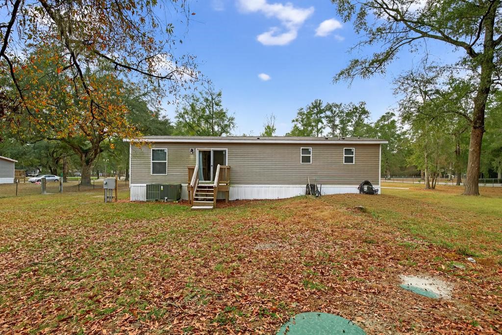 1088 Mulberry Landing Road Hilliard, FL 32046 - Photo 23 of 30 a view of a house with a yard