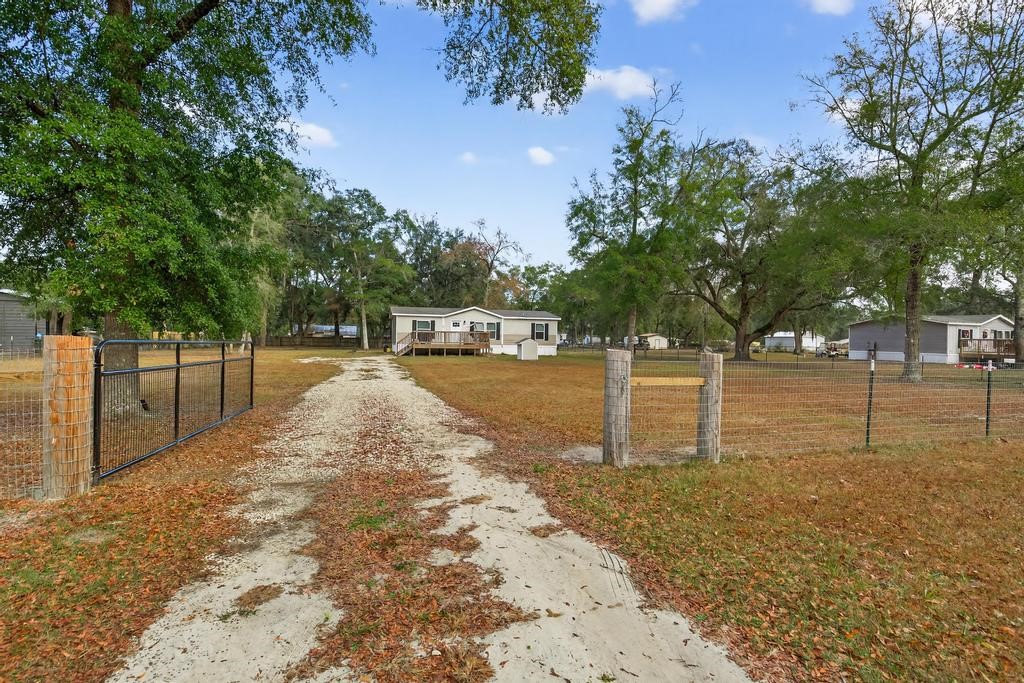 1088 Mulberry Landing Road Hilliard, FL 32046 - Photo 3 of 30 a view of a yard with trees