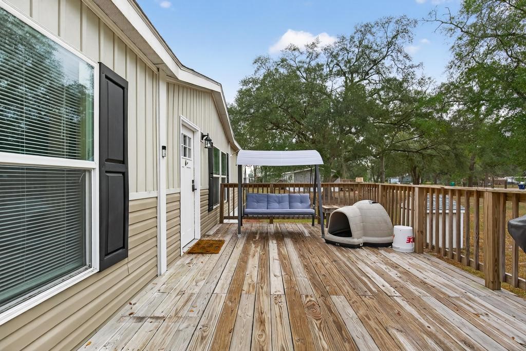 1088 Mulberry Landing Road Hilliard, FL 32046 - Photo 5 of 30 a view of balcony with wooden floor and fence