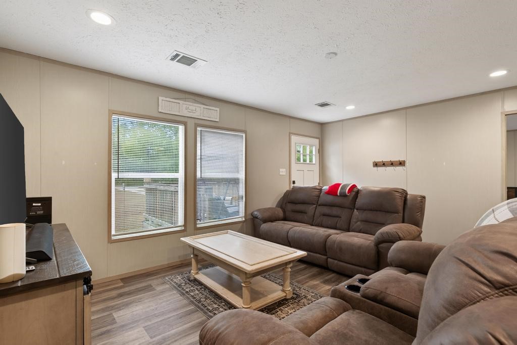 1088 Mulberry Landing Road Hilliard, FL 32046 - Photo 8 of 30 a living room with furniture and a window