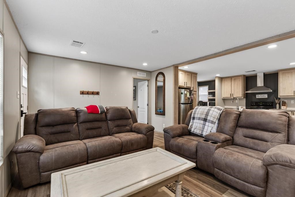 1088 Mulberry Landing Road Hilliard, FL 32046 - Photo 9 of 30 a living room with furniture and a couch