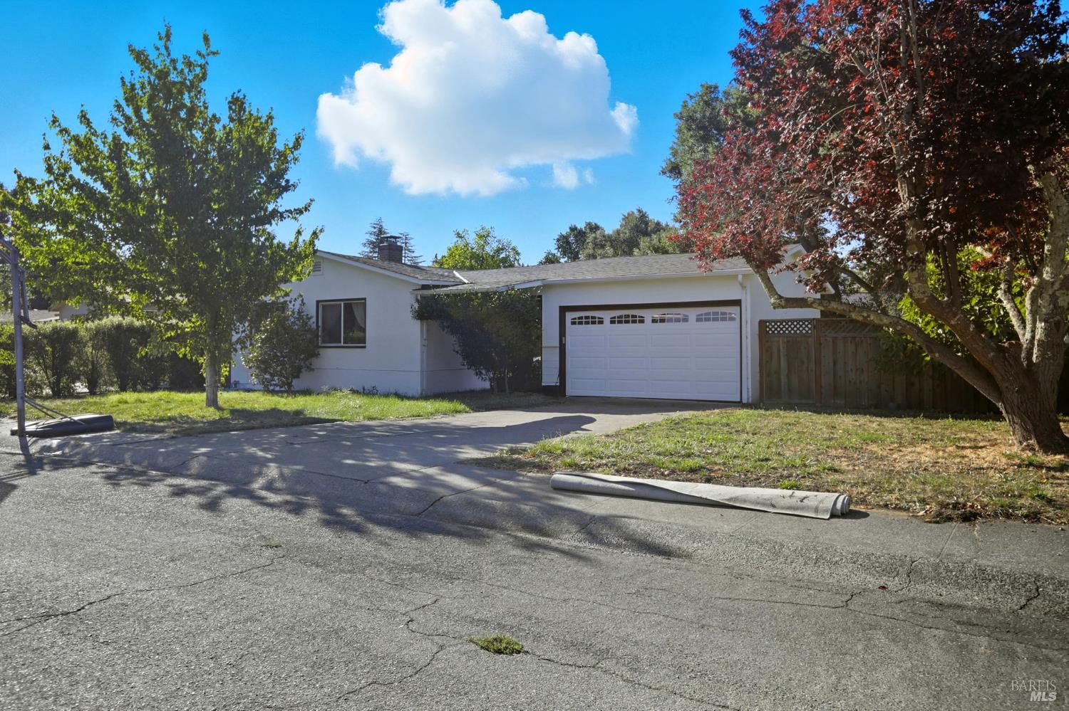 840 Wilmac Avenue Novato, CA 94947 - Photo 1 of 1 a front view of a house with a yard and garage
