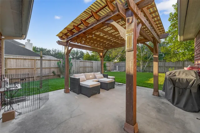 a view of house with backyard and a garden