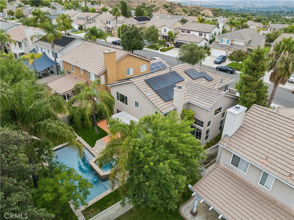 26023 Salinger Lane Stevenson Ranch, CA 91381 - Photo 31 of 35 Backyard view featuring solar panels.