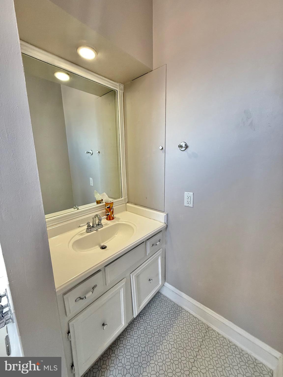 718 Oronoco Street, Unit 2 Alexandria, VA 22314 - Photo 13 of 27 a bathroom with a sink and a mirror