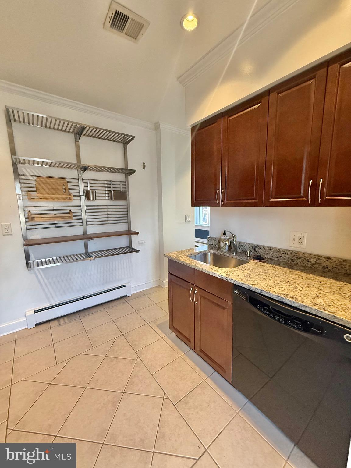 718 Oronoco Street, Unit 2 Alexandria, VA 22314 - Photo 15 of 27 a spacious bathroom with a granite countertop sink and a mirror