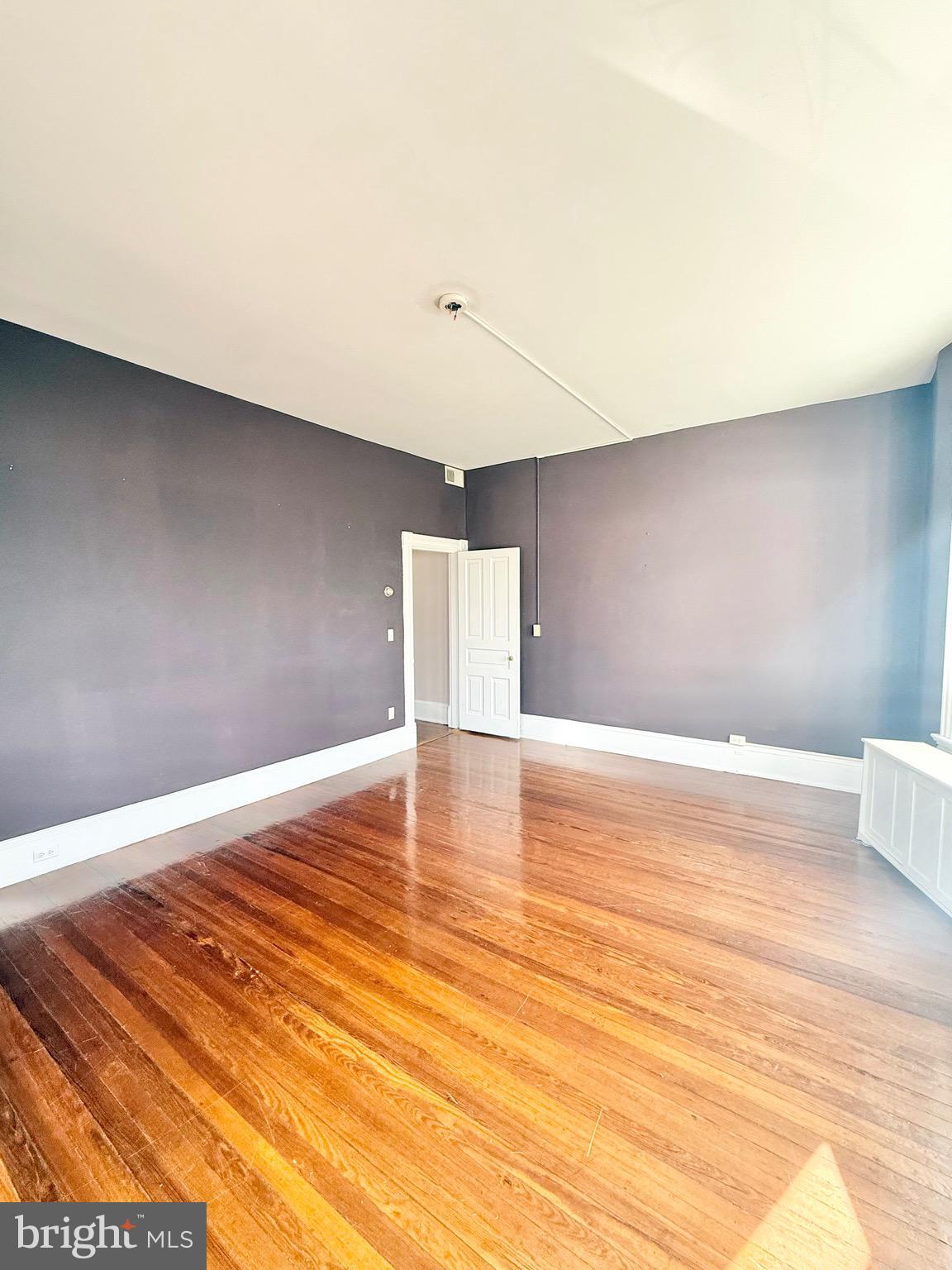 718 Oronoco Street, Unit 2 Alexandria, VA 22314 - Photo 3 of 27 a view of empty room with wooden floor