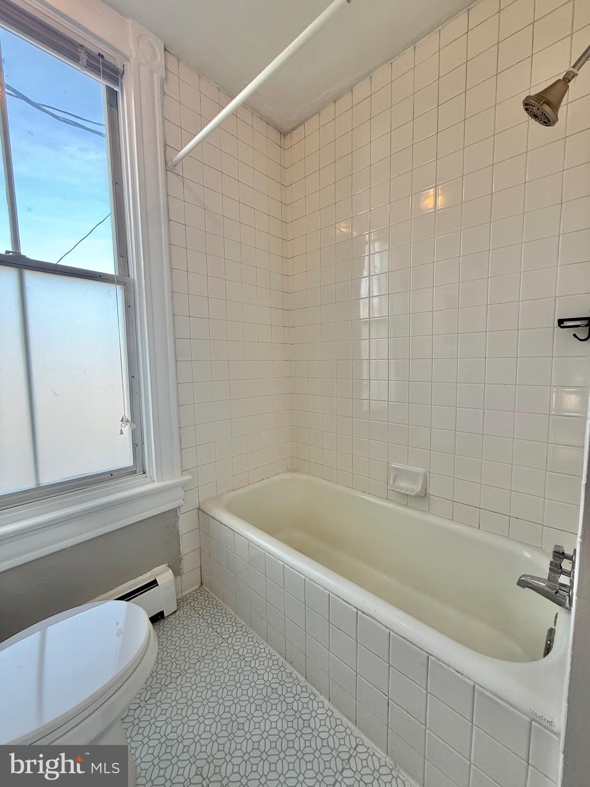 718 Oronoco Street, Unit 2 Alexandria, VA 22314 - Photo 10 of 27 a bathroom with a bathtub and a shower