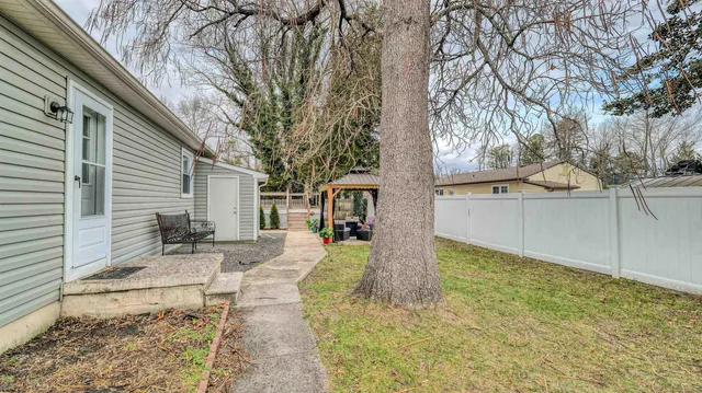 a view of a back yard of the house