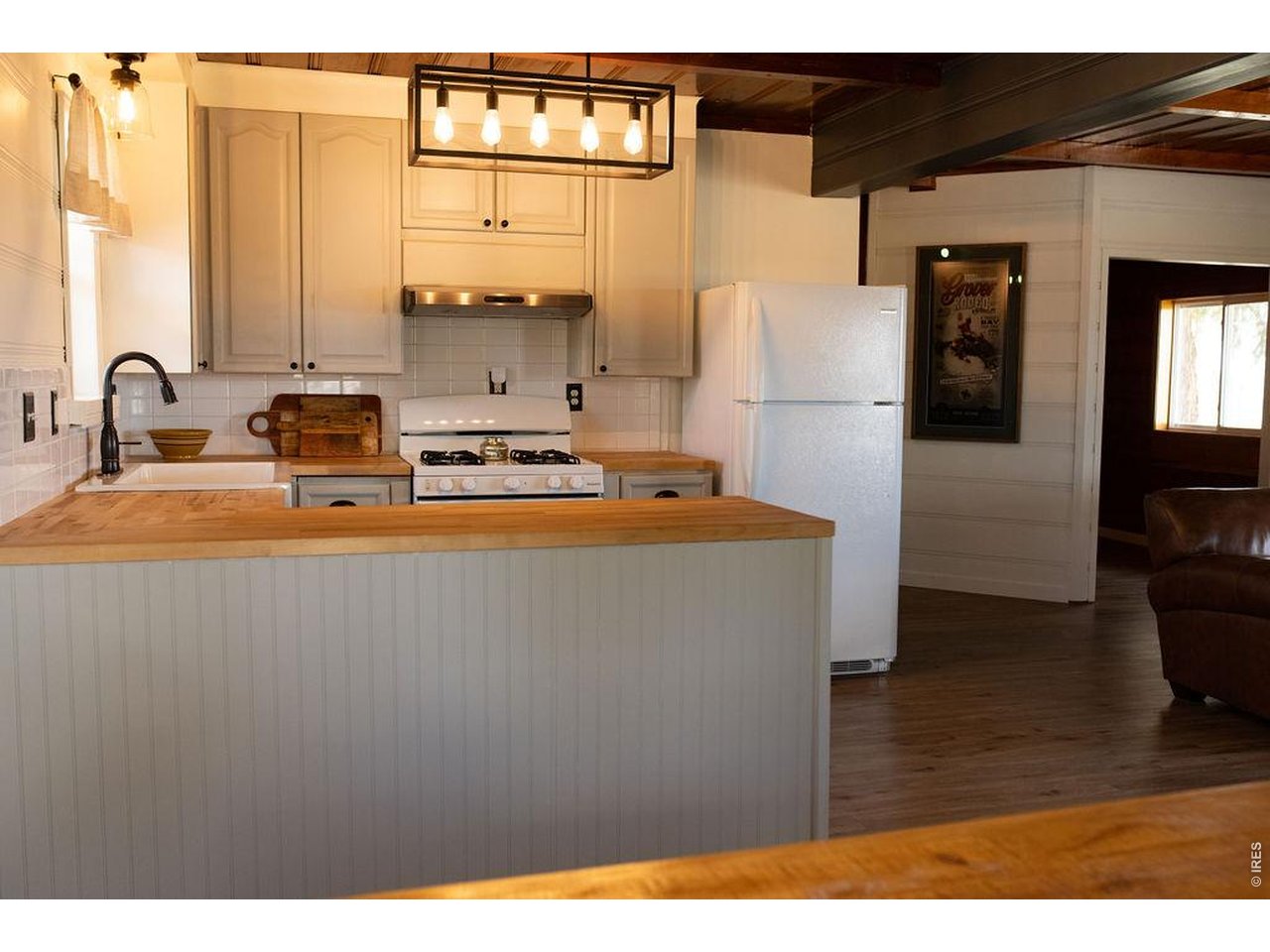 218 Pershing Street Grover, CO 80729 - Photo 13 of 50 Charming Country Kitchen with Modern Updates, Designer Lighting, and Farmhouse Sink