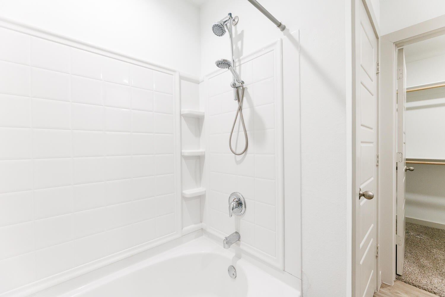 2305 150th Street Lubbock, TX 79423 - Photo 23 of 39 a bathroom with a bathtub and shower
