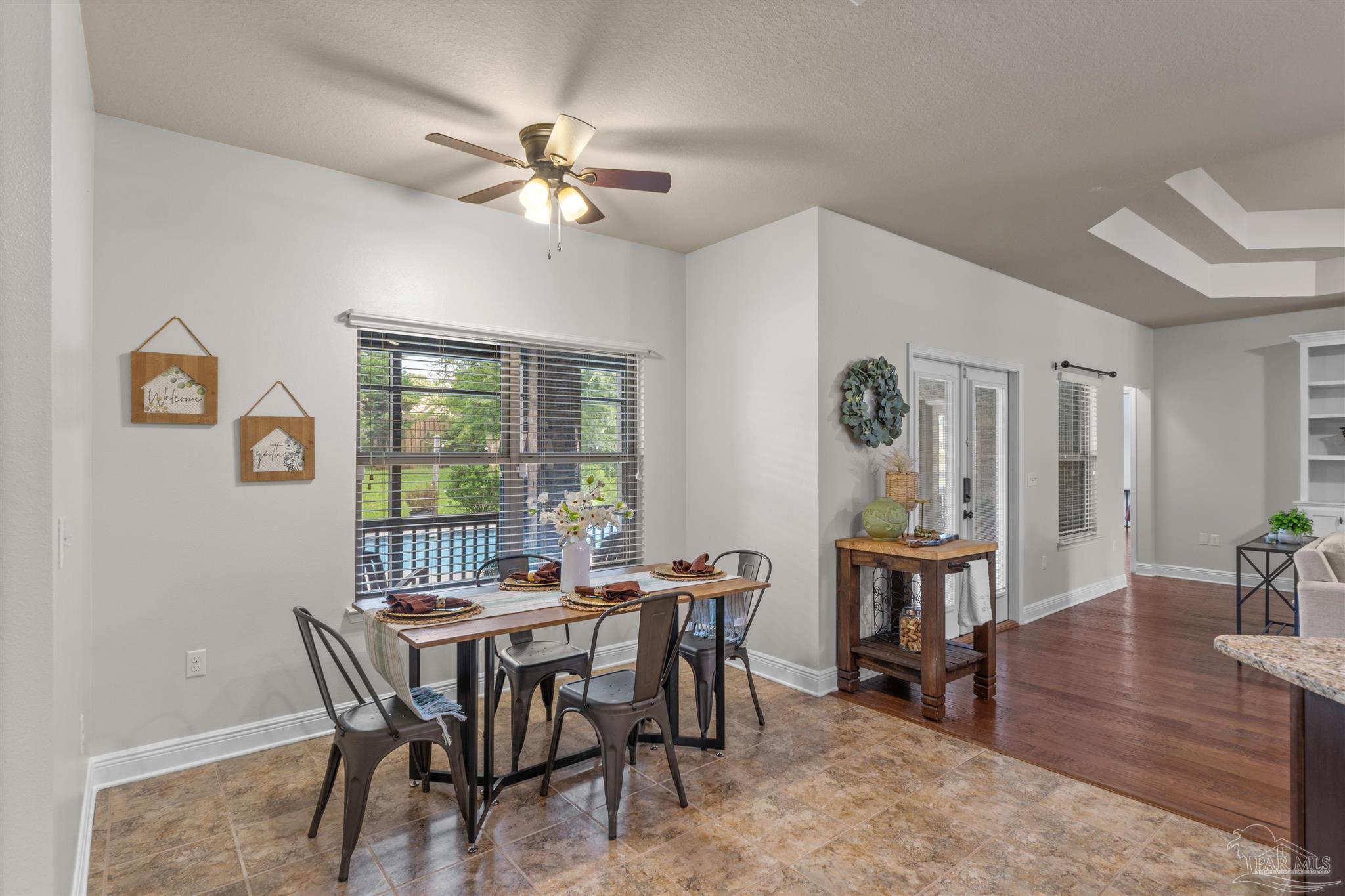 2698 Tulip Hill Road Pace, FL 32571 - Photo 21 of 65 a view of a dining room with furniture window and wooden floor