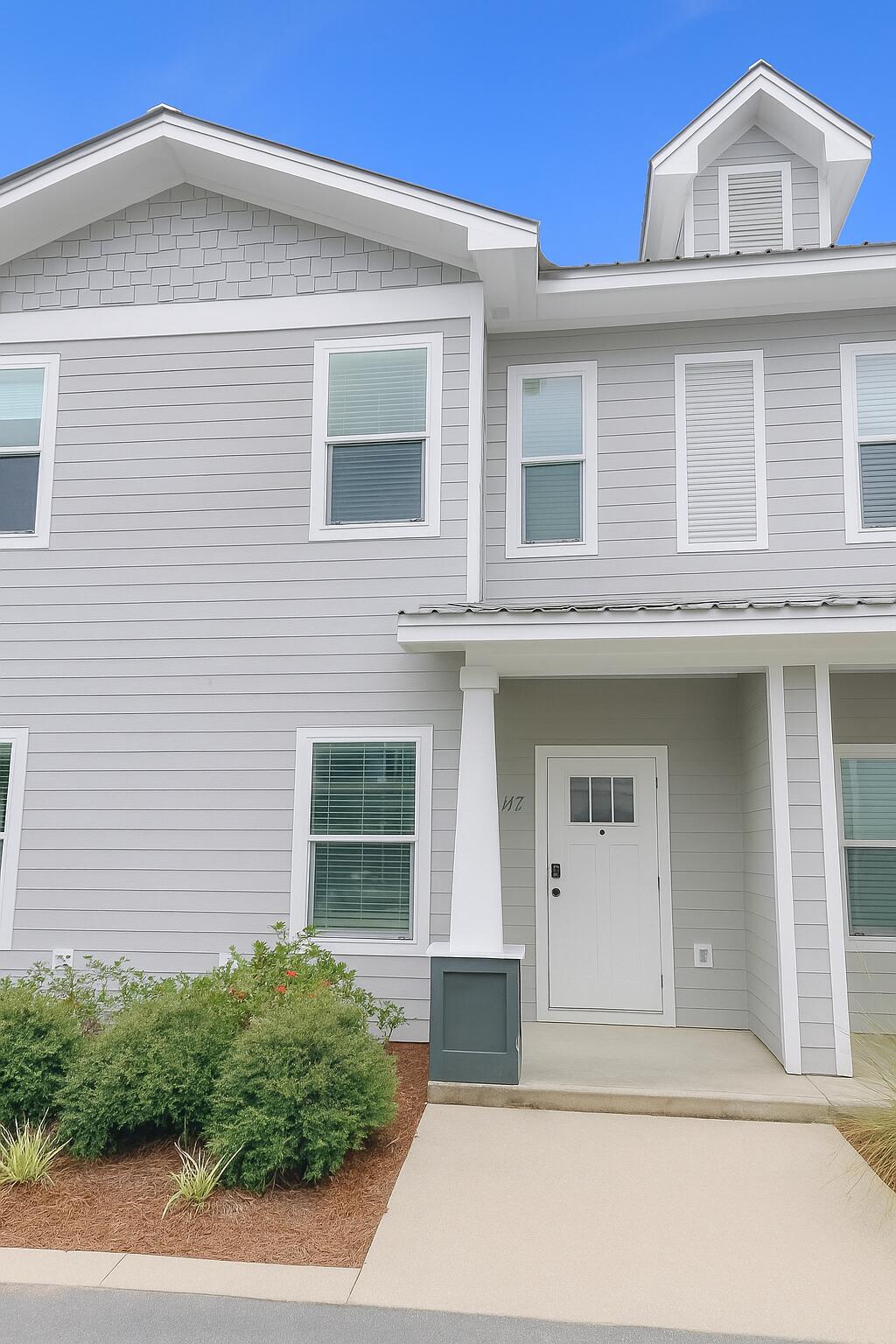a front view of a house with a garage