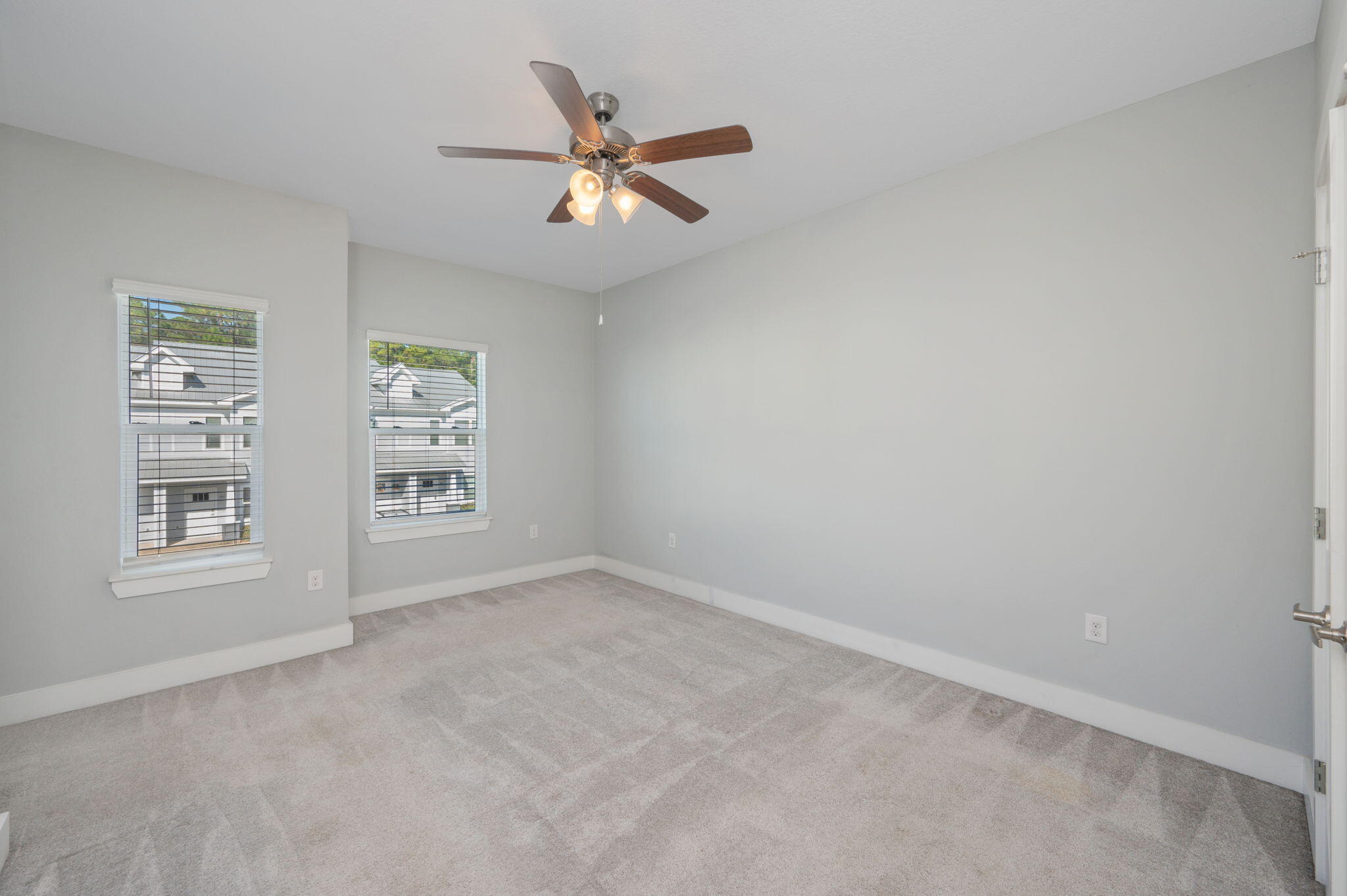 147 North Sand Palm Road Freeport, FL 32439 - Photo 21 of 39 an empty room with windows and fan