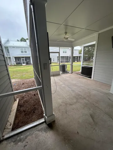 a view of an empty room with a fireplace