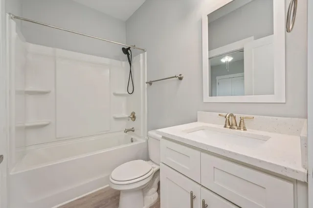 a bathroom with a bath tub with a shower
