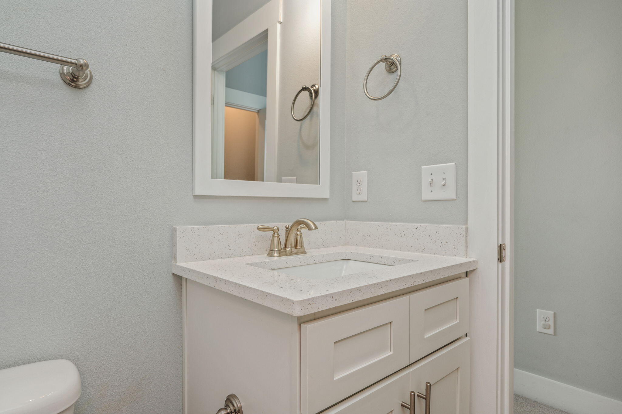 147 North Sand Palm Road Freeport, FL 32439 - Photo 31 of 39 a bathroom with a sink vanity and a mirror