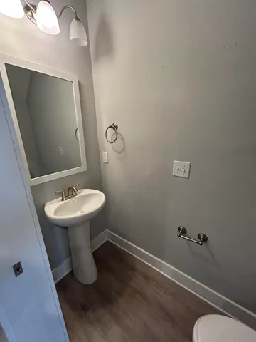 a bathroom with a sink and mirror
