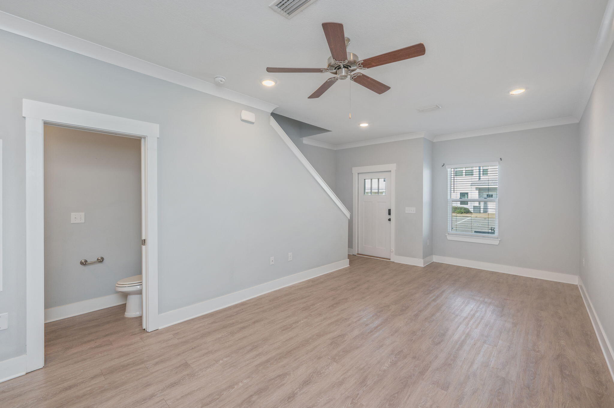 147 North Sand Palm Road Freeport, FL 32439 - Photo 9 of 39 wooden floor in an empty room with a window