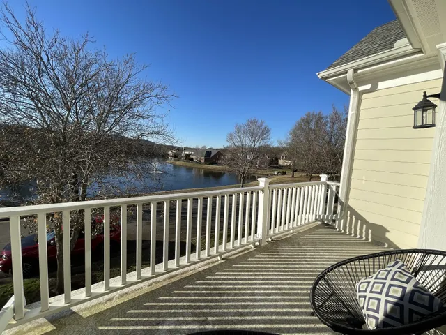 a view of balcony with wooden floor