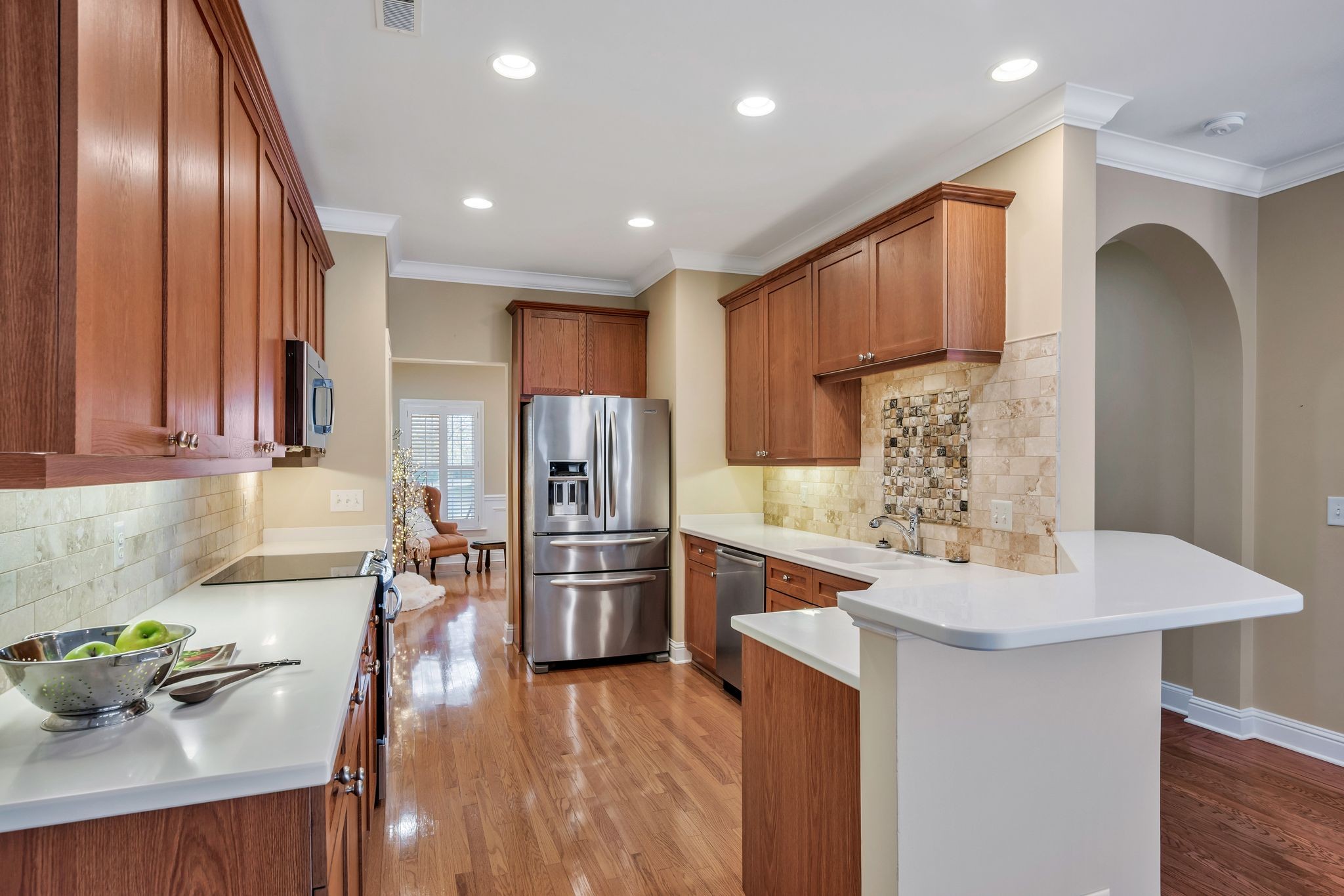 626 Springlake Drive Franklin, TN 37064 - Photo 8 of 22 a kitchen with stainless steel appliances granite countertop a refrigerator a sink a stove and island