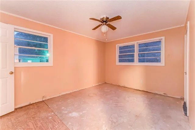 a kitchen with stainless steel appliances granite countertop wooden cabinets a sink and dishwasher a stove with wooden floor