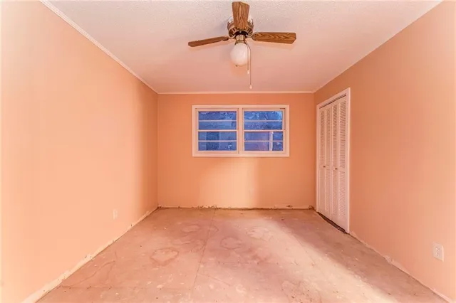 a kitchen with granite countertop stainless steel appliances white cabinets and a sink