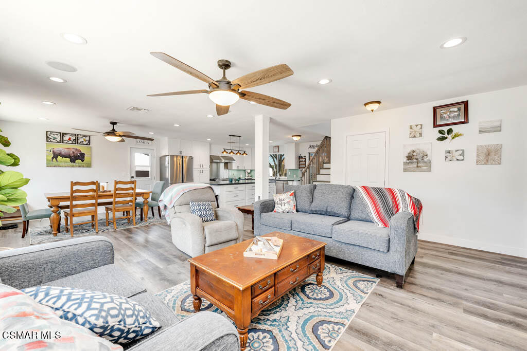 615 Appleton Road Simi Valley, CA 93065 - Photo 7 of 17 a living room with furniture a rug and a ceiling fan