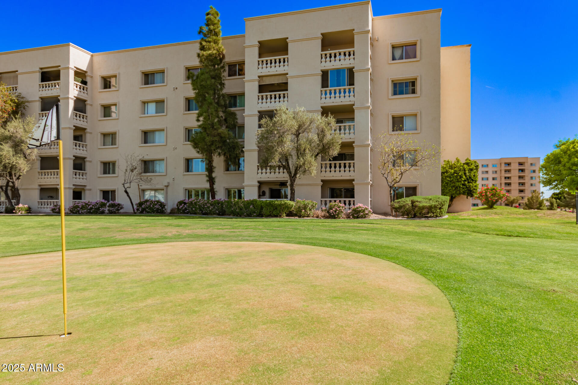 a view of a building with a yard