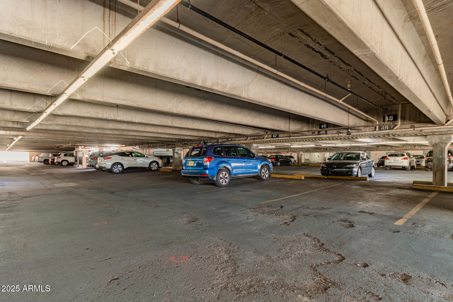 7910 East Camelback Road, Unit 104 Scottsdale, AZ 85251 - Photo 11 of 38 a car in garage