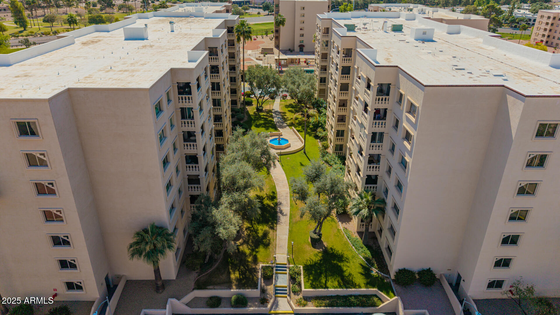7910 East Camelback Road, Unit 104 Scottsdale, AZ 85251 - Photo 14 of 38 an aerial view of residential houses with outdoor space and trees