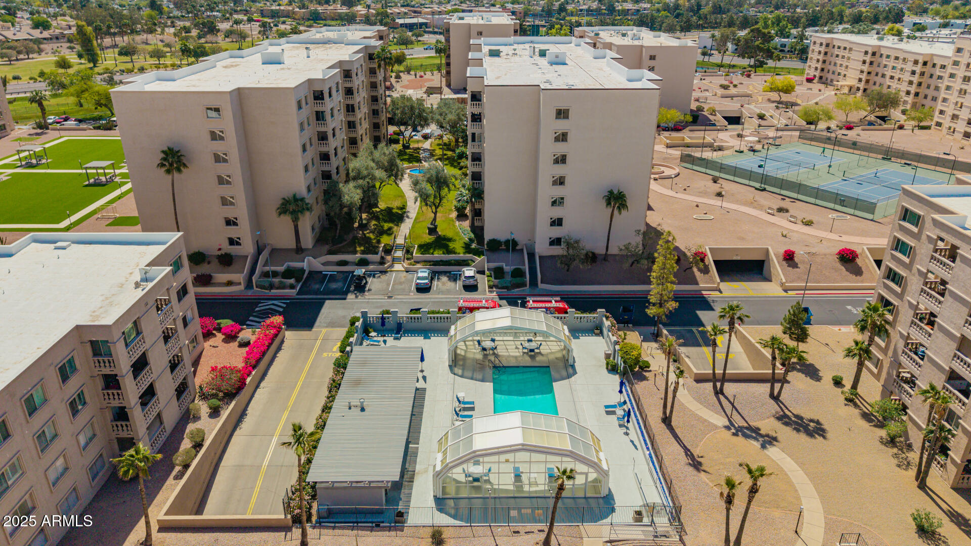 7910 East Camelback Road, Unit 104 Scottsdale, AZ 85251 - Photo 16 of 38 an aerial view of residential houses with outdoor space