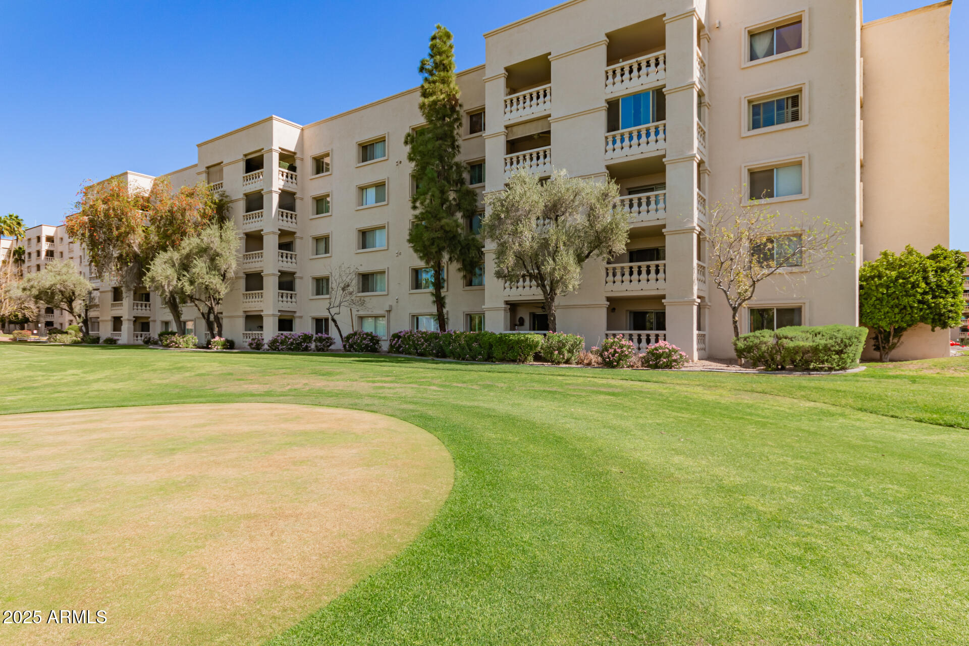7910 East Camelback Road, Unit 104 Scottsdale, AZ 85251 - Photo 2 of 38 a view of building with yard