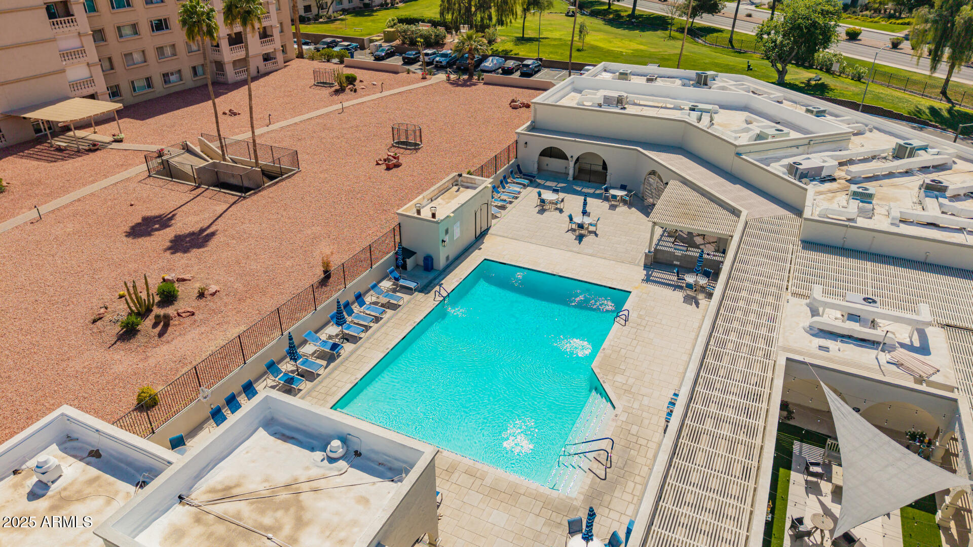 7910 East Camelback Road, Unit 104 Scottsdale, AZ 85251 - Photo 24 of 38 an aerial view of a house with a garden and swimming pool