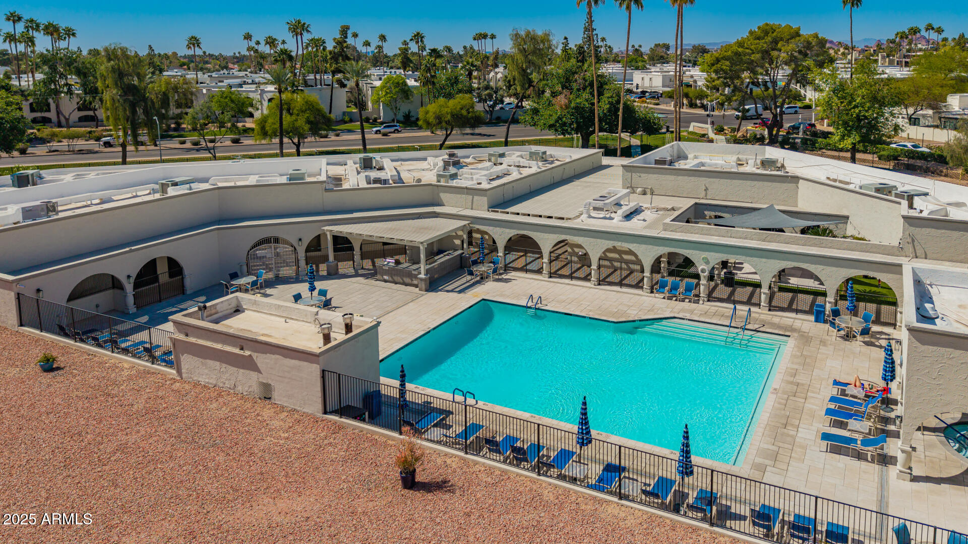 7910 East Camelback Road, Unit 104 Scottsdale, AZ 85251 - Photo 25 of 38 an aerial view of a house with outdoor space and swimming pool