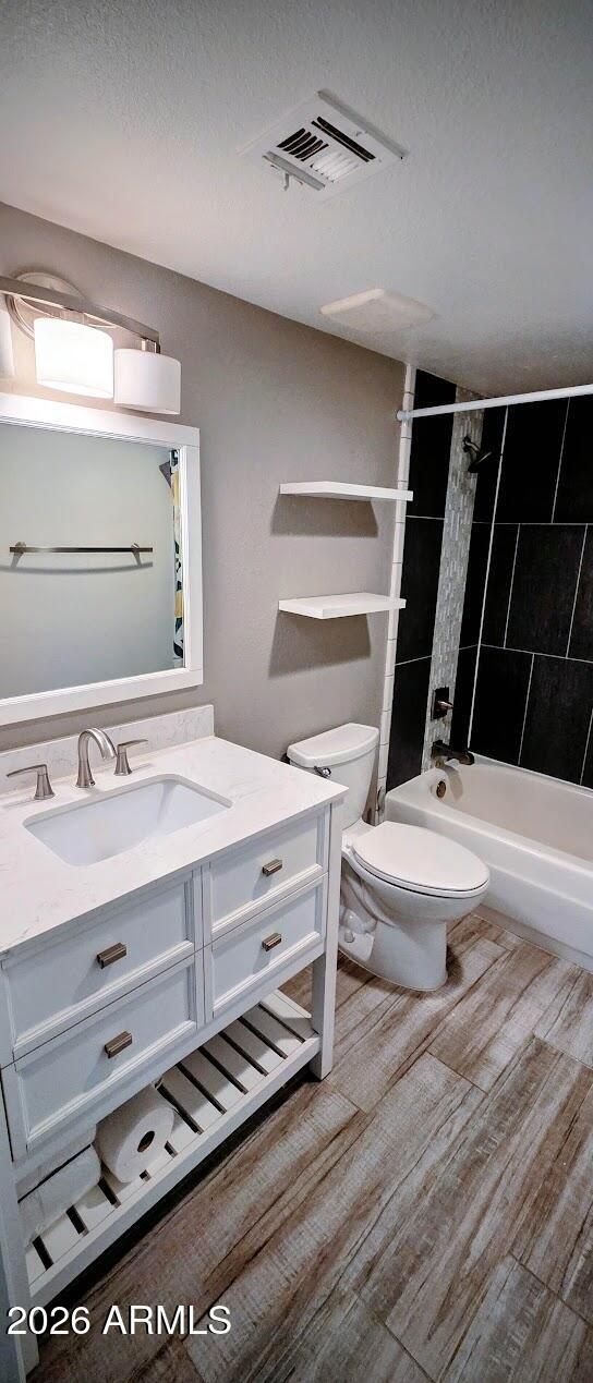 7910 East Camelback Road, Unit 104 Scottsdale, AZ 85251 - Photo 32 of 38 a bathroom with a sink a toilet and mirror