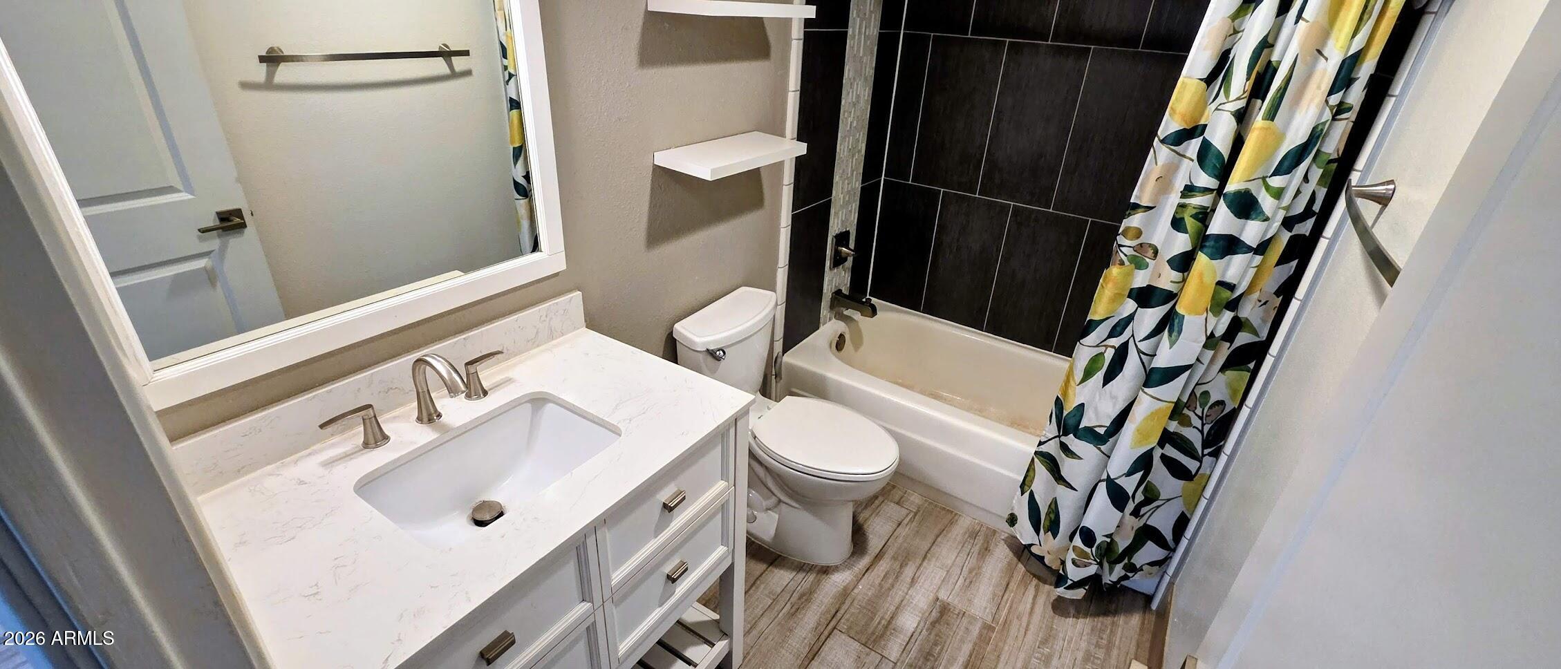 7910 East Camelback Road, Unit 104 Scottsdale, AZ 85251 - Photo 33 of 38 a bathroom with a sink and a toilet